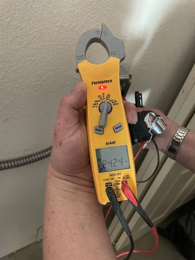 Voltage testing with clamp meter during Outlet Installation in Marlborough
